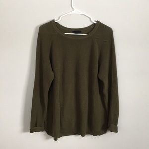 Olive green sweater, thinner and long.